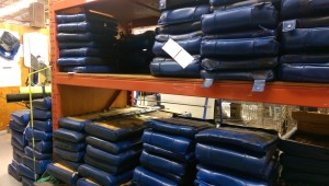 Picture of seat cushions stacked in warehouse.